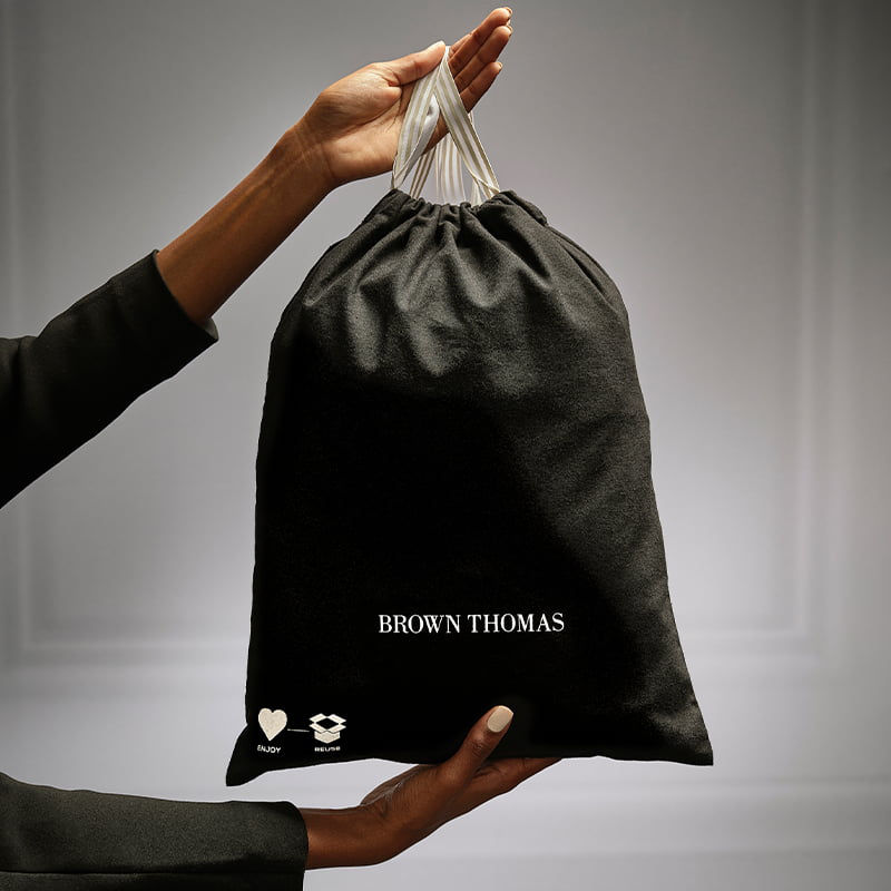 woman holding Brown Thomas gift bag