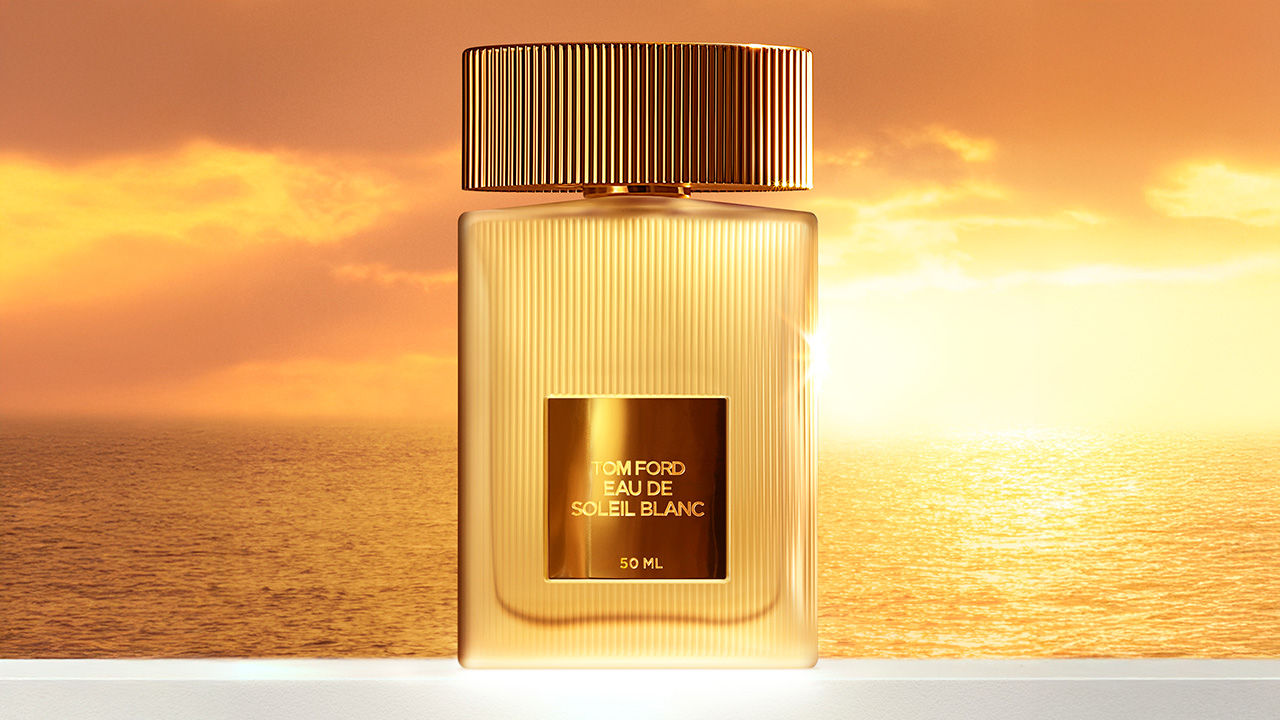 Tom Ford Eau de Soleil Blanc bottle against a sunset backdrop, highlighting luxury and elegance.