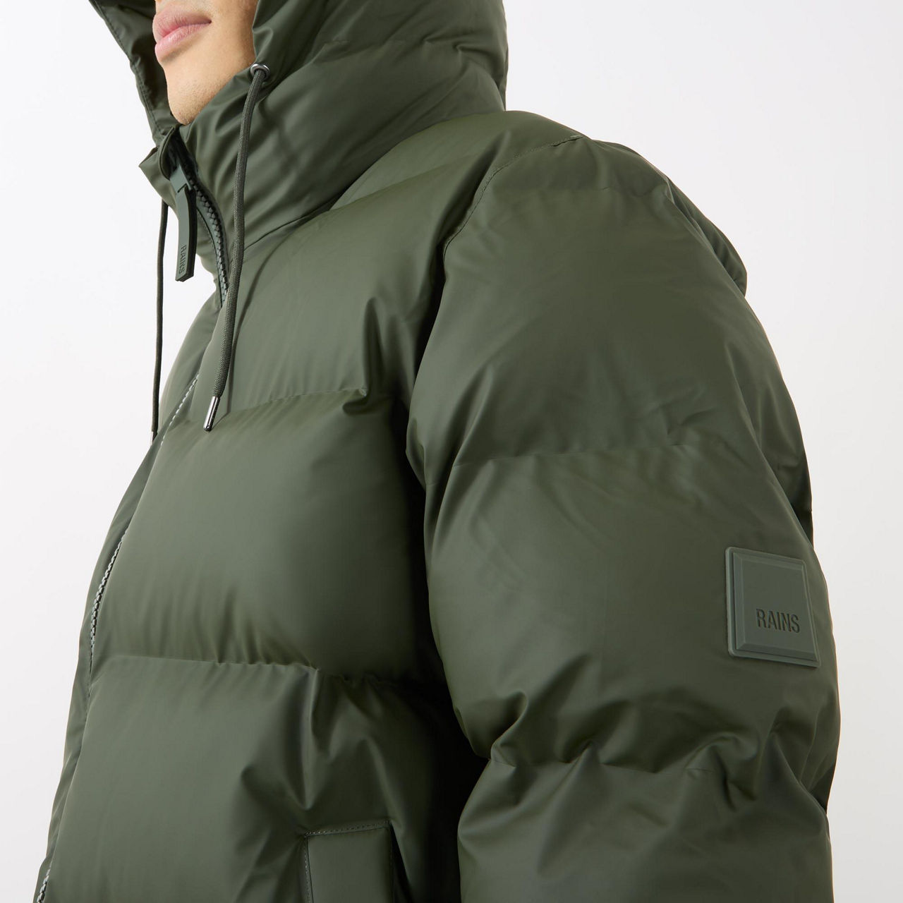 Rains® Alta Long Puffer Jacket in Green for $680
