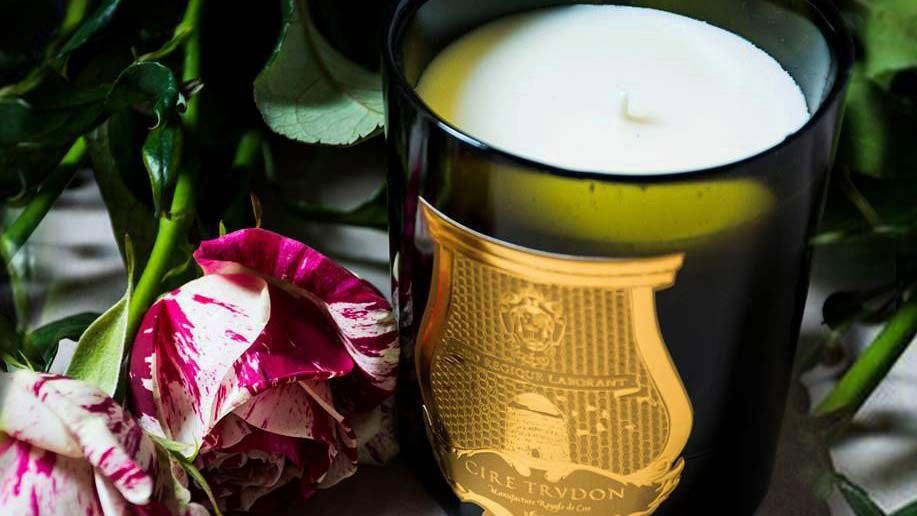 Cire Trudon candle surrounded by roses