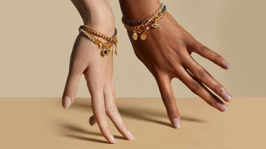 women's hands with bracelets on