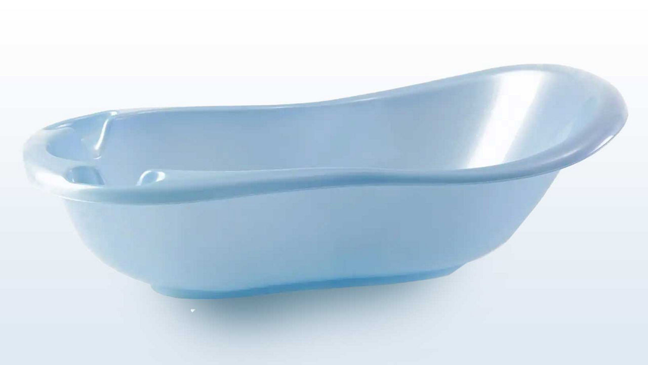 Product shot of a light blue plastic elegance baby bath on a grey backdrop